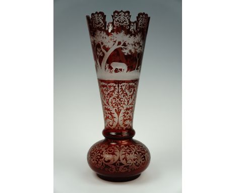 A late 19th century Bohemian ruby flashed and finely wheel cut glass vase, (a/f), 31 cm