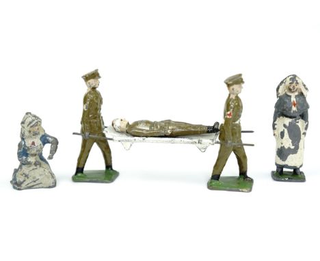 Great War JoHillCo die cast lead toy medical orderlies carrying a wounded soldier on a stretcher, together with two model nur