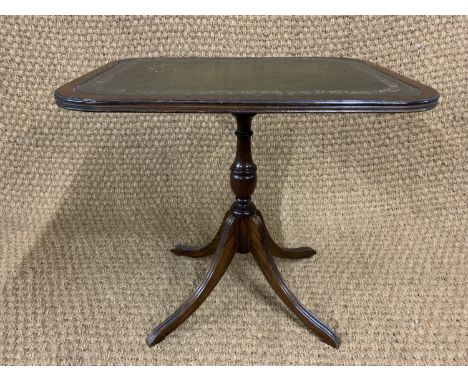 A George III influenced mahogany lamp table, having an inset gilt tooled green leather top and four reeded splayed legs, 50 c