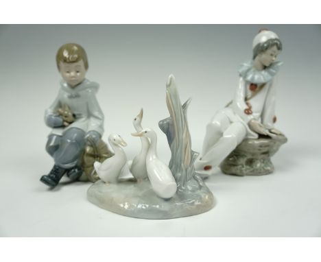 Three NAO figurines; a clown, a boy with rabbit, and geese, (boy a/f)