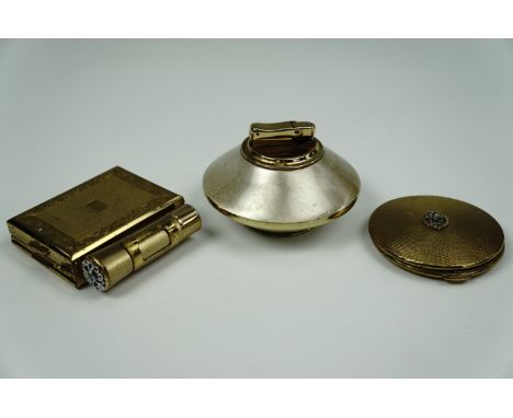 A mid 20th century minaudiere together with a KIGU compact and a similar table lighter