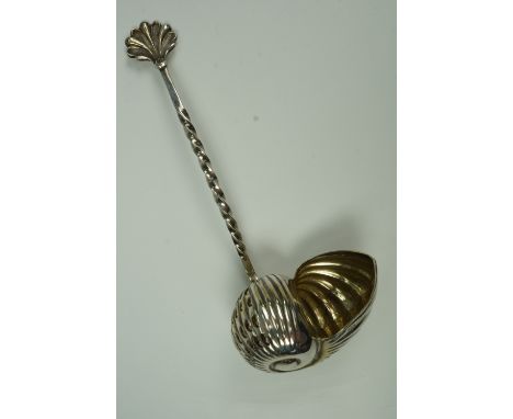 An electroplate condiment ladle in the form of a shell