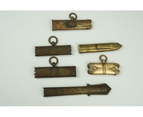 A group of sword scabbard brass lockets and chapes