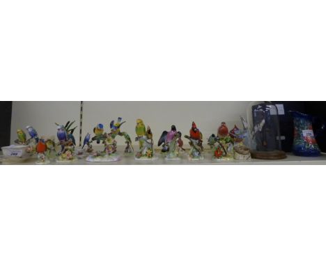 A quantity of mainly Royal Adderley china birds together with a Border Fine Arts kingfisher, glass fish, cups and saucers etc