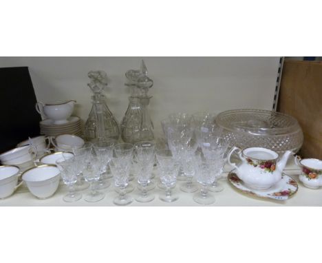 A collection of glassware including heavy cut decanters together with a quantity of Royal Worcester teaware etc