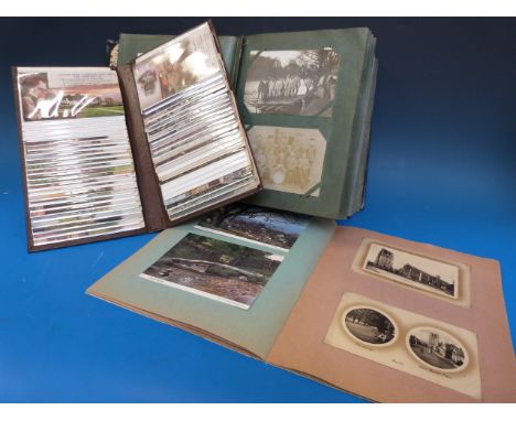 Three albums of postcards including Cobham, Military groups, Ipswich, Quetta, Southend, Zeppelins including wrecked engine et