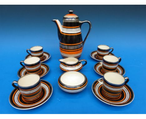An Art Deco Grays Pottery coffee set with a black, orange and gold banded design