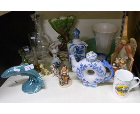 A collection of ceramics and glass to include Goebel figures, Poole trout etc 