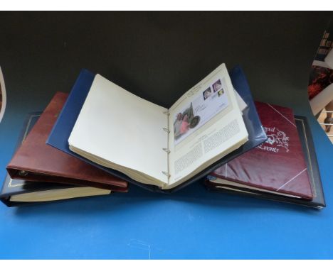 A large quantity of GB first day covers in album and an album of Royal Family coin/stamp covers.