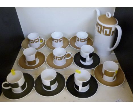 Six Susie Cooper Wedgwood cups and saucers in the 'Heraldry' pattern and a coffee pot and four cups and saucers in the Old Go