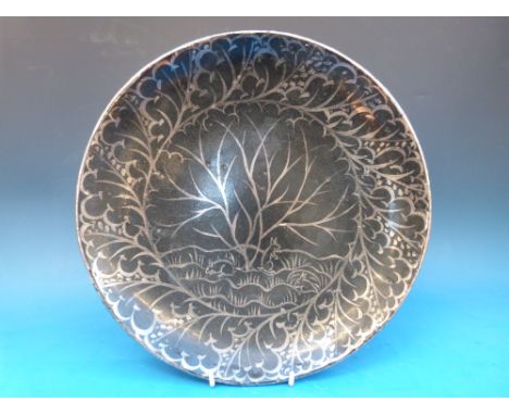 A Wedgwood Art Pottery bowl by Louise Powell with decoration of rabbits in a woodland setting, 31.5cm