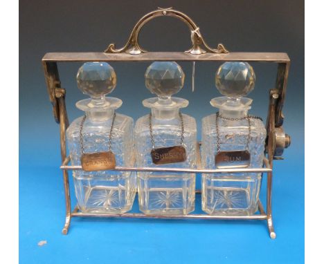 An Art Deco plated three-bottle tantalus