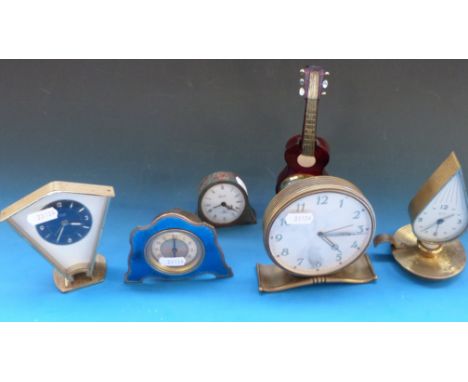 A collection of small novelty clocks including guitar, nightlight and guilloche enamel