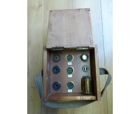 A set of nine Star Diagonal Lenses by W. Watson & Sons together with a telescope and tripod by the same maker 