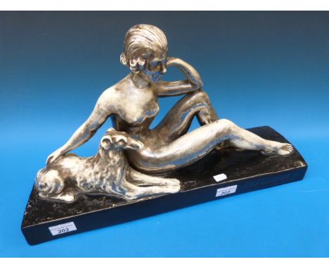 An Art Deco reclining nude with Borzoi dog in unusual chromed glaze and impressed L. Francois to base