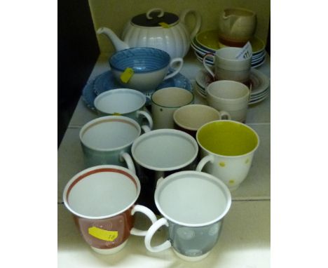 A collection of Susie Cooper teaware variously decorated with concentric circles, polka dots, feathers etc 
