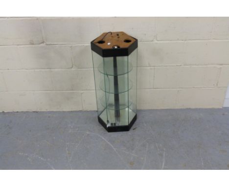 A revolving shop display cabinet with electric lighting