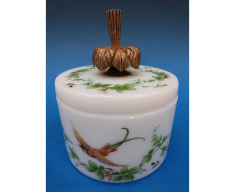 A Baccarat opaline glass powder jar with enamel bird and leaf decoration, the top in the form of an upturned flower, signed R