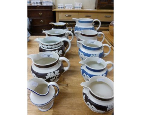 A collection of relief moulded jugs to include Turners, Spode style etc. 