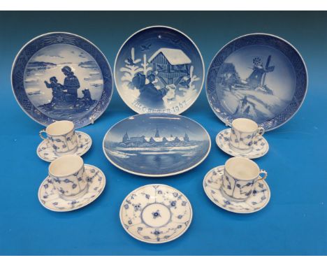 Two Copenhagen Christmas plates together with four Copenhagen coffee cans and five saucers 