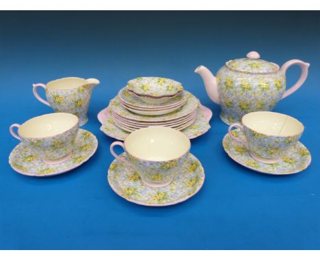 A Shelley 'Primrose' pattern tea set including teapot, milk jug, cake plate, frilled dishes etc