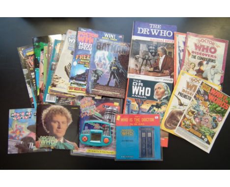 Collection of Doctor Who collectors items, including 1973 annual and a sixties annual, USA print single record, and two other