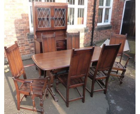 Ercol dining table, six chairs and a similar dresser. Condition reports are not available for our Interiors Sales.