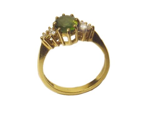 18ct gold peridot and small diamond ring. Condition reports are not available for our Interiors Sales.