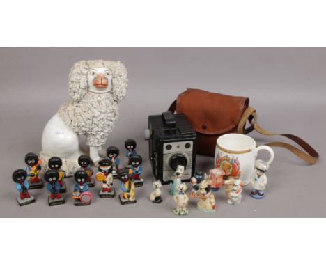 A group of collectables to include Robertson advertising figure, box camera, mantle dog, Wade whimsies etc.