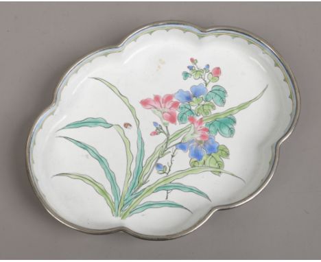 A Cantonese enamel lobbed tray decorated with flowers.