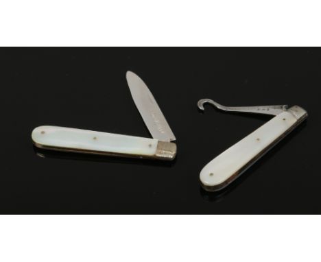 A Victorian silver fruit knife with mother of pearl scales and a silver button hook with mother of pearl scales.