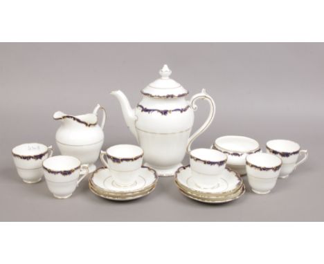 A Coalport six place bone china coffee service decorated with blue enamel and gilding including coffee pot, cream jug, sugar 