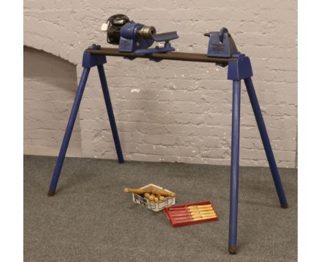 A record drill master lathe with 240 volt motor raised on a steel stand model No. DML / 24 along with a selection of wood tur