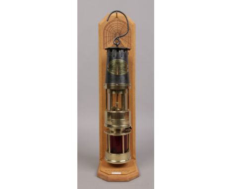 A rare J. H. Naylor spiralarm type M miners lamp on lazer engraved collectors stand c1950-60.