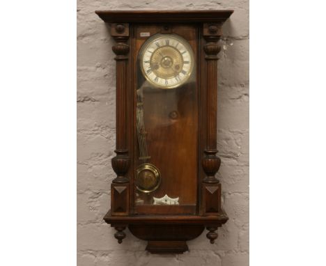 A Victorian mahogany cased Springer wall clock with brass / enamel dial numeral markers chiming on a coiled gong complete wit