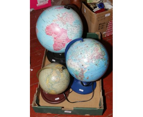 A Chad Valley tin plate globe, along with two light up examples.