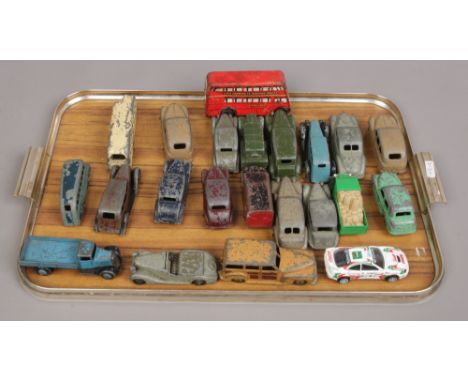 A tray of twenty two vintage Dinky die cast vehicles and a tinplate Brimtoy bus.