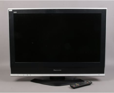 A Panasonic Viera 32inch flat screen television model TX - 32LXD70 with remote control.