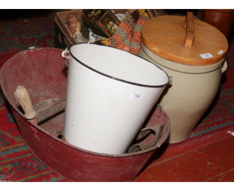 A painted galvanised steel seed dispenser, along with an enamel bucket and a twin handled stoneware lidded pot.