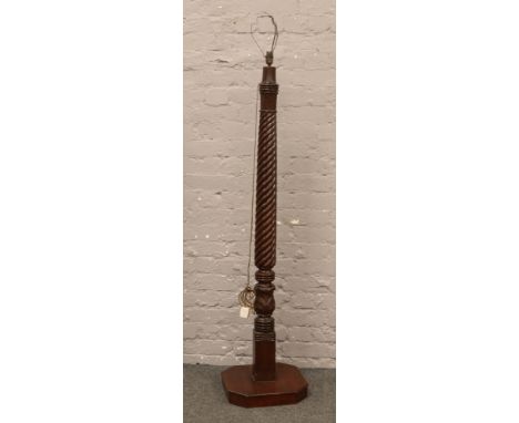 A turned mahogany sugar twist carved standard lamp.
