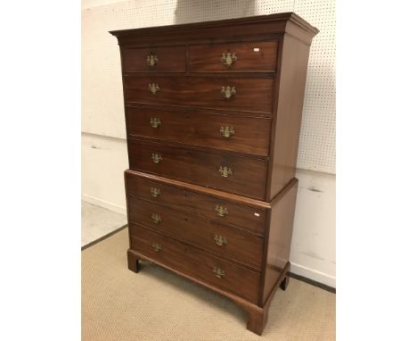 A 19th Century mahogany chest on chest, the upper section with moulded cornice over two short and three long graduated drawer