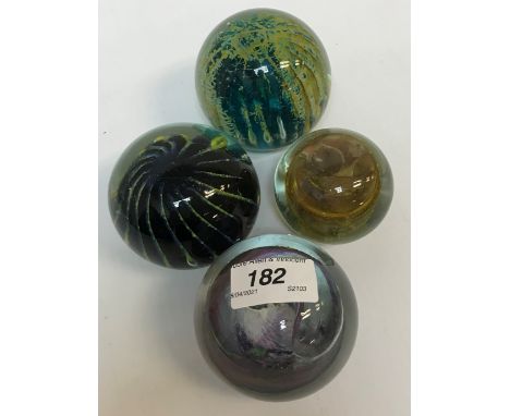 A Mdina coloured glass paperweight, an Isle of Wight coloured glass paperweight, two others similar, a pair of cut glass mall