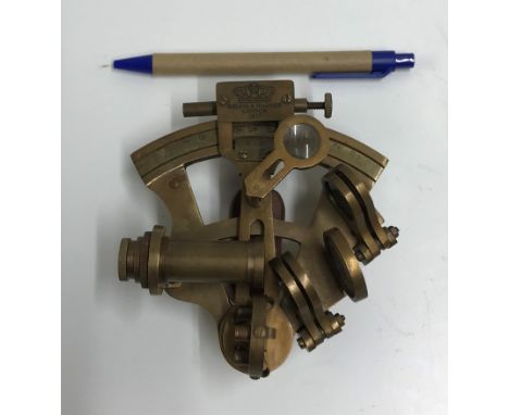 A modern decorative brass sextant inscribed "Kelvin &amp; Hughes London 1917"