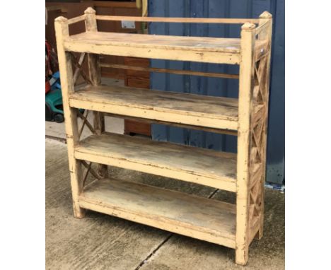 A 20th Century Indian painted teak open shelf unit of four tiers on square supports, 110 cm wide x 30.5 cm deep x 123.25 cm h