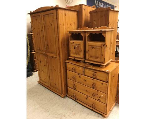 A pine chest of two short over three long drawers, 91 cm wide x 50 cm deep x 86 cm high, a pair of pine bedside cabinets,  37