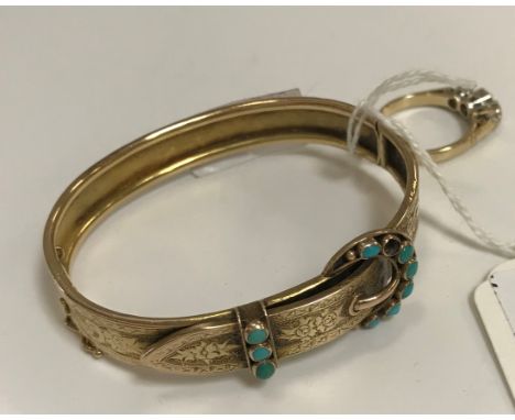 A Victorian yellow metal bangle in the form of a belt, set with turquoise beads on the buckle(unmarked), together with a 9 ca