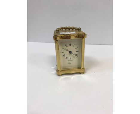 A modern Rapport brass cased carriage clock in the Victorian style, 11.5 cm high x 8 cm wide x 7.5 cm deep