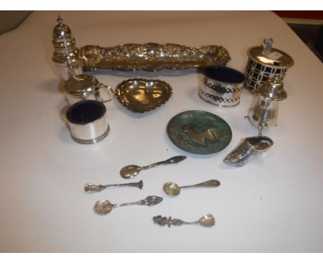 A collection of silver wares to include a pierced drum mustard with associated blue glass liner (by William Hutton &amp; Sons