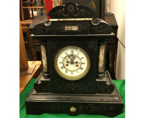 A late Victorian slate and marble cased mantel clock with gilt lined scrolling foliate decoration, the eight-day movement wit