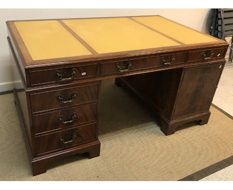 A modern Nimes of Downley Bucks partner's desk, the plain top with leather inserts above three drawers over two banks of thre